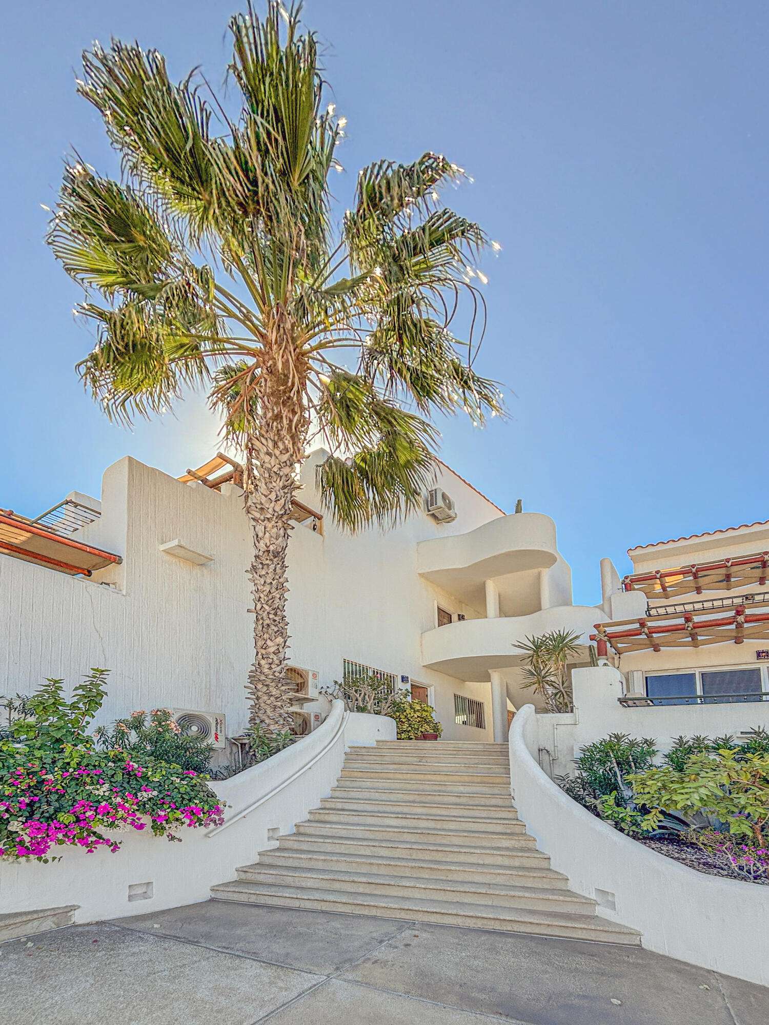 Los Cabos Dunes Residence Club Enjoy resort-style living with this 3-bedroom corner ground-floor residence at The Palmilla Dunes. This contemporary-style condo is offered fully furnished and turn-key, blending modern design with warm finishes, including travertine floors, parota wood furnishings, and GE Profile appliances. The ''Palm Garden Residence'' layout features a primary bedroom with a king bed and private terrace, plus two back bedrooms, one with two double beds and one with a king, making it ideal for family and guests. Indoor-outdoor living is seamless with pocket doors, a covered exterior terrace, and BBQ area, complemented by a private putting green perfect for fun and entertaining. An oversized one-car garage is located directly in front of the unit, and a luxury six-seater golf cart is included for convenient access to Palmilla's shopping centers, restaurants, and swimmable beach.Whether you're looking for a private vacation retreat or an investment rental, this property offers a ready-to-enjoy lifestyle, with optional access to The Dunes Club amenities, including tennis, pickleball, and paddle courts, gym and spa, semi-Olympic pool, jacuzzi, movie theater, sports bar, and clubhouse. for sale