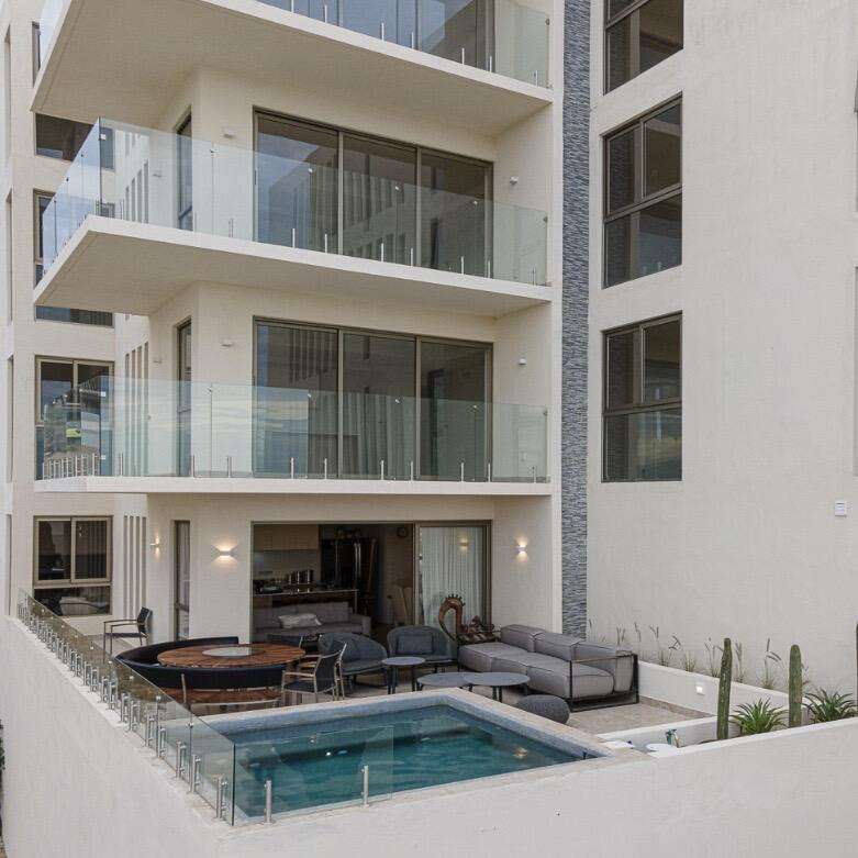 Los Cabos Cabo Costa TURNKEY FULLY FURNISHED 2-BEDROOM CONDO WITH PRIVATE PLUNGE POOL. Beautiful turnkey 2-bedroom ground-floor condo in Duna Tower at Cabo Costa, Cabo San Lucas. Features a private patio with dipping pool, ideal for seamless indoor-outdoor living and strong rental appeal. The unit offers two spacious en-suite bedrooms and a modern design with neutral finishes, creating a comfortable and inviting space.Cabo Costa is a newer community designed to blend architecture with nature, offering a tranquil and upscale environment.Amenities include clubhouse, infinity pool, gym, sundeck, kids' area, jacuzzi, wet bar, snack bar, and massage area.Ideal as a vacation home or investment property. – Cabo Costa - Duna Garden, Cabo Corridor, Cabo Corridor, BS