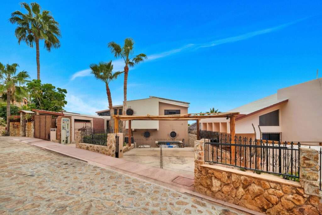 Los Cabos Finisterra SEE PRIVATE REMARKS TO TOUR !58 Paseo Finistera rests on Over 1/3 acre Corner lot.Finistera is San Jose's most sought after private neighborhood. Close to downtown.A spacious 4 bedroom, 5 full baths home. Including two Casitas one casita offers a second kitchen!A solid rock wall surrounds the property.This 4,000 square foot custom built resorthome offers 14 foot high soaring ceilings throughout.The entry offers a 15 foot high dome ceiling,for light. Mature cactus landscaping, plus graceful terraces surround the large pool and jacuzzi.The circular stone fire pit area surrounded with built in benches has spacious seating.Full bathroom with shower located outside in yard area.Large laundry room with storage – Camino del Conejo, PEDREGAL, Cabo San Lucas, BS