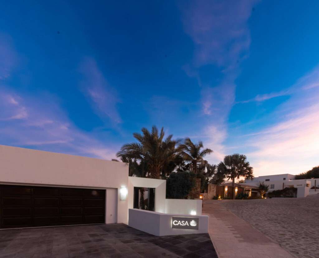 Los Cabos Los Valles Sophisticated and solidly built, this 5,588 sq.ft. estate in Club Campestre offers luxury living with exceptional construction quality rarely found in Los Cabos. Residents enjoy exclusive access to a private beach club and world-class golf course, all just minutes from San Jose vibrant dining and culture. The home features 4 ensuite bedrooms, a 3-stop elevator, and a Generac backup system. Entertain in style with a chef's kitchen, wine room with Tzalam wood cabinetry, and an outdoor BBQ area with fire pit. Relax by the heated pool or on the Jacuzzi terrace with partial ocean – Camino del Pacifico, Cabo San Lucas, BS