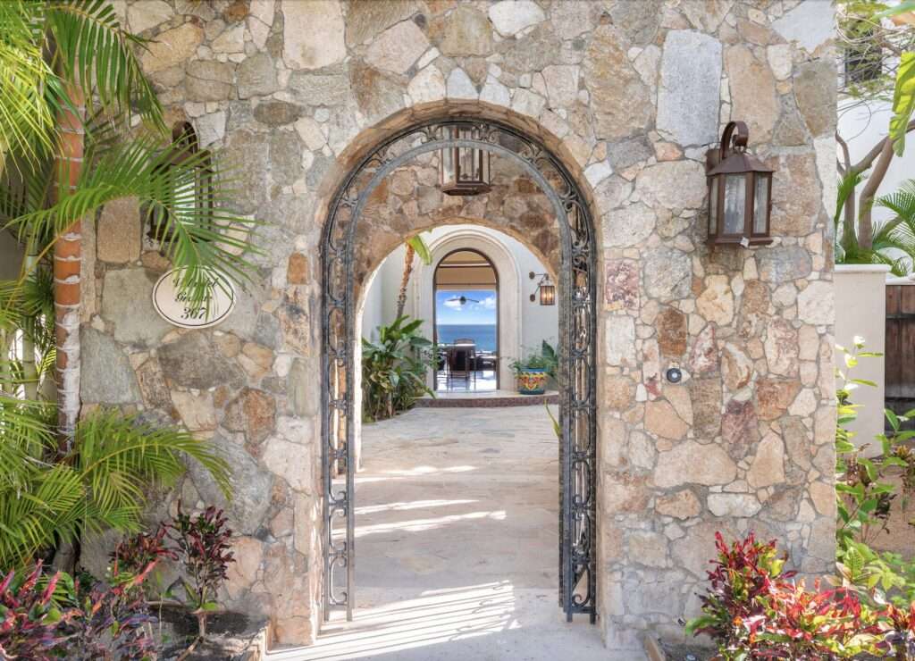 Los Cabos Los Valles Sophisticated and solidly built, this 5,588 sq.ft. estate in Club Campestre offers luxury living with exceptional construction quality rarely found in Los Cabos. Residents enjoy exclusive access to a private beach club and world-class golf course, all just minutes from San Jose vibrant dining and culture. The home features 4 ensuite bedrooms, a 3-stop elevator, and a Generac backup system. Entertain in style with a chef's kitchen, wine room with Tzalam wood cabinetry, and an outdoor BBQ area with fire pit. Relax by the heated pool or on the Jacuzzi terrace with partial ocean – De Las Estrellas, Cabo San Lucas, BS