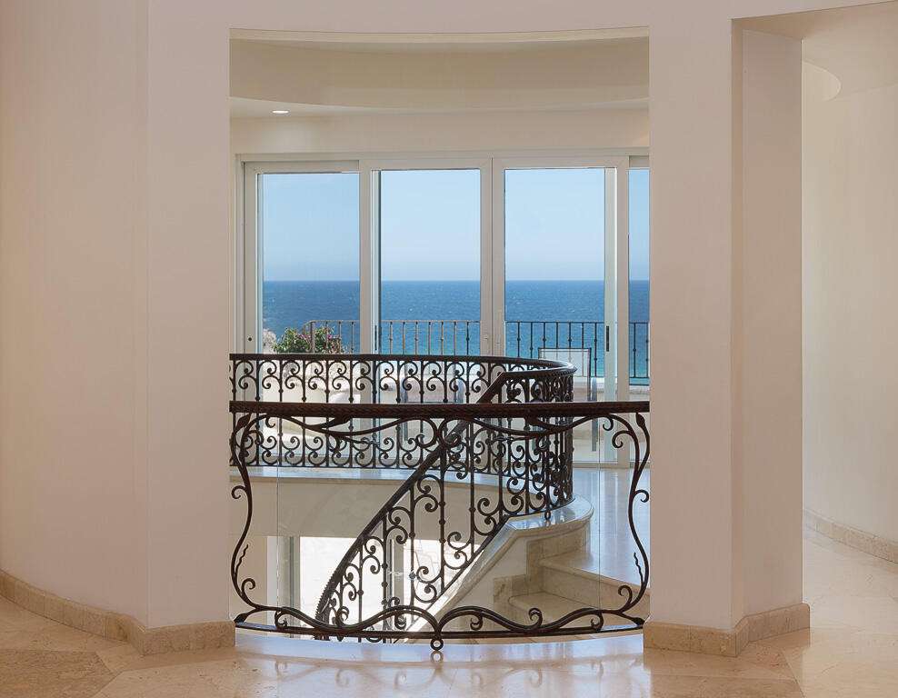 Los Cabos Los Valles Sophisticated and solidly built, this 5,588 sq.ft. estate in Club Campestre offers luxury living with exceptional construction quality rarely found in Los Cabos. Residents enjoy exclusive access to a private beach club and world-class golf course, all just minutes from San Jose vibrant dining and culture. The home features 4 ensuite bedrooms, a 3-stop elevator, and a Generac backup system. Entertain in style with a chef's kitchen, wine room with Tzalam wood cabinetry, and an outdoor BBQ area with fire pit. Relax by the heated pool or on the Jacuzzi terrace with partial ocean – Lote 15 Villa Marcella | Manzana 282, Cabo San Lucas, BS