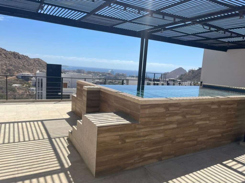 Los Cabos Vista Vela Sunset Penthouse fully furnished and turnkey, located in VistaVela Sunset. This PH features spacious interiors, an open-concept living and dining area, and a fully equipped kitchen with appliances included. The unit comes completely furnished, ready to move in or start generating rental income immediately.The highlight of the property is its oversized private rooftop terrace, offering ample space to design and create any concept you envision -- from a lounge area, outdoor kitchen, jacuzzi, or entertainment space. Ideal for those looking to customize their outdoor living experience and maximize the Cabo lifestyle.Amenities:6 swimming poolsFully equipped fitness centerClubhousePadel and pickleball courtsLandscaped gardens and green areasPutting green24/7 gated security – Lunaterra, Cabo San Lucas, Cabo San Lucas, BS