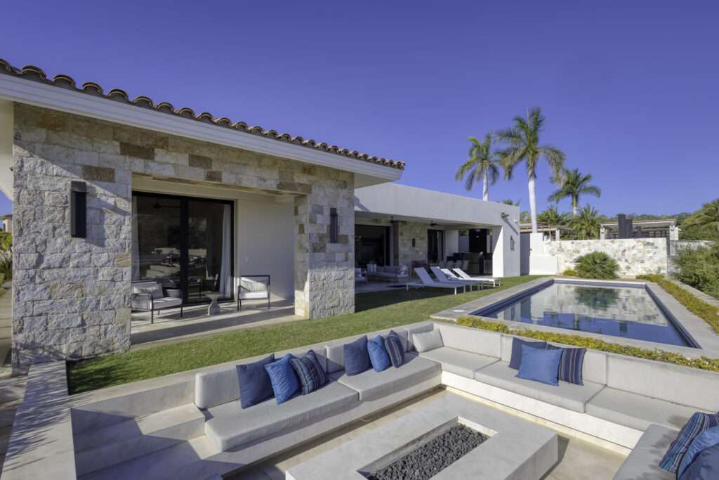 Los Cabos Fundadores Fully remodeled with entertaining in mind, Casa Reino is a stunning Spanish Colonial-style residence located within the double-gated Fundadores community of Puerto Los Cabos. Designed for hosting extended family and friends while maintaining exceptional privacy, this custom-built home blends timeless architecture with modern luxury and efficiency.An expansive pool terrace invites relaxed lounging under the renowned Los Cabos sunshine, complemented by shaded outdoor living and dining areas and multiple interior courtyards that provide privacy for guest suites. A brand-new bar, media, and entertainment room creates the perfect setting for dinner parties and special events.The thoughtful floor plan features a luxurious master suite with soaking tub and indoor/outdoor shower, along with four private guest suites, each positioned for comfort and seclusion. Modern upgrades throughout the home include all-new plumbing, air conditioning, doors, windows, lighting, and furnishings.Designed for efficiency and convenience, Casa Reino is equipped with a solar system, solar pool heater/chiller, and solar heat pump, keeping operating costs low. Additional highlights include an oversized two-car garage with commercial refrigerator and freezer, a new laundry room with dual washer/dryer sets, and a new BBQ cook center with wet bar, icemaker, and refrigeration. The pool has been newly refinished, exterior travertine decking installed, and a complete hurricane shutter system added.Residents of Puerto Los Cabos enjoy 27 holes of Nicklaus and Norman signature golf, with the option to transfer a golf membership at the purchaser's cost. Membership also includes access to tennis and pickleball courts. Fundadores HOA fees include exclusive access to the Fundadores Beach Club, featuring an oceanfront infinity pool, Jacuzzi, fitness center, event lawn, restaurant, and spa services.Ideally located just 5 minutes from the Puerto Los Cabos Marina, 10 minutes from downtown San José del Cabo, and 30 minutes from Los Cabos International Airport, Casa Reino offers effortless access to world-class dining, shopping, and lifestyle amenities.Special Features & UpgradesSolar system in placeSolar pool heater and chillerNewly remodeled pool with new finishesNew exterior travertine deckingNew bar / media / family roomNew laundry room with double washer & dryersNew air conditioning throughoutNew furnishingsNew kitchen appliances: refrigerator, two dishwashers, ice maker, beverage fridge & drawersNew sinks and faucets in kitchenSonos sound systemNew doors and windowsNew hurricane protection systemNew interior and exterior lightingCommercial refrigerator and freezer in garageNew countertops and cabinetry in kitchenette and bath at Guest Casita #4 – Palmilla Estates 58, San Jose Corridor, San Jose Corridor, BS